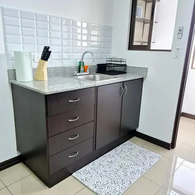a kitchen with a sink and a counter top at Moderno apartamento en San Jose CR in San José