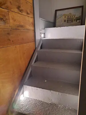 a set of stairs with a picture of the coliseum at Apartamento Céntrico con Vista in Heredia