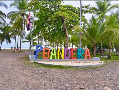 a sign that says barrarra on a beach at Paraiso En-suite #3 in Parrita