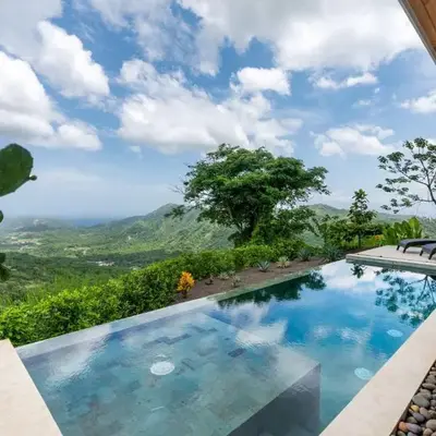 Mountainside Home with Modern Design Sweeping Ocean Views & Private Swimming Pool