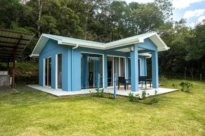 a blue tiny house in a yard at Casa grano de oro in Turín