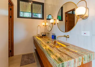 a bathroom with a sink and a mirror at Casa Rocky Point in Nosara
