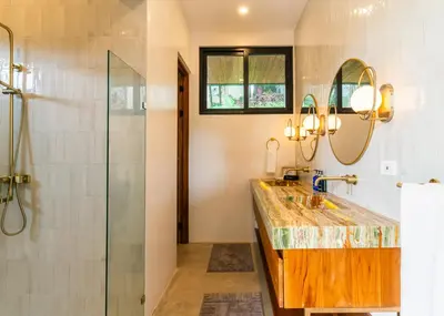 a bathroom with a sink and a shower at Casa Rocky Point in Nosara