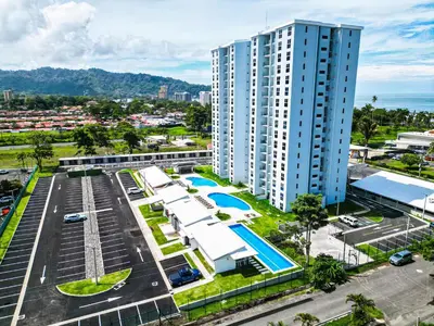 an aerial view of a building and a parking lot at Viva Jaco Unit 0605 in Jacó