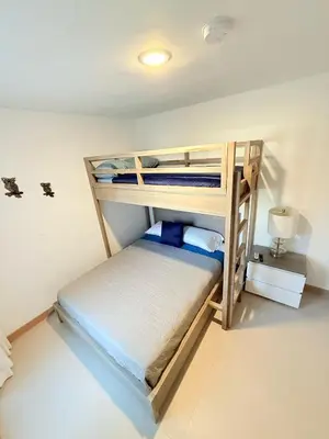 a bedroom with two bunk beds in a room at Viva Jaco Unit 0605 in Jacó