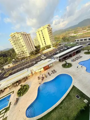 an overhead view of a swimming pool in a resort at Viva Jaco Unit 0605 in Jacó
