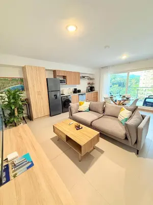 a living room with a couch and a coffee table at Viva Jaco Unit 0605 in Jacó