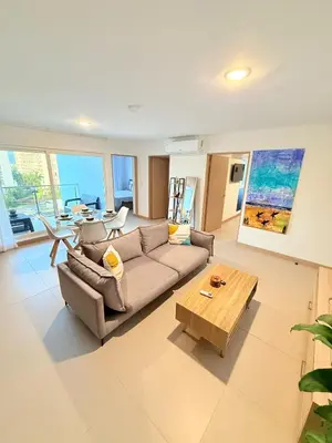 a living room with a couch and a coffee table at Viva Jaco Unit 0605 in Jacó
