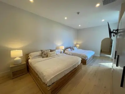 a bedroom with two beds and two lamps in it at Welcome to paradise!Reserva Conchal, Solaris, C-1A in Playa Conchal