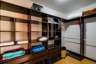 a room with a bunk bed with shelves at CR MARIPOSA RENTALS lakeview, spacious penthouse with office, pool, gym, Jacuzzi in Santa Ana