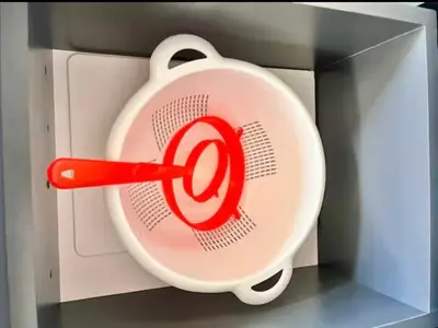 a red target inside of a toy refrigerator at EBK Surf Apartamento 1 in Santa Cruz