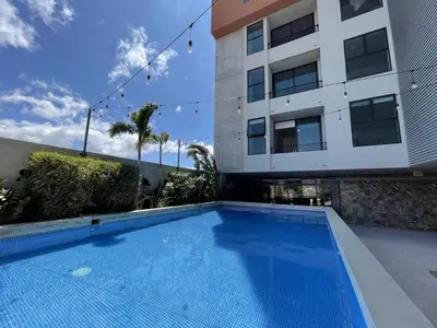 a swimming pool in front of a building at Modern Stay in Trendy Escalante 1803 in Tapantí