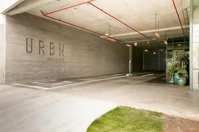 an empty parking lot with the words uturn on a wall at URBN Cozy Studio Sunset 806a in Tapantí