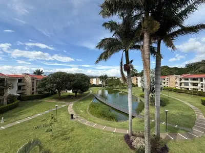 a park with palm trees and a body of water at CR MARIPOSA RENTALS Brand New lake view Penthouse with office space in Santa Ana
