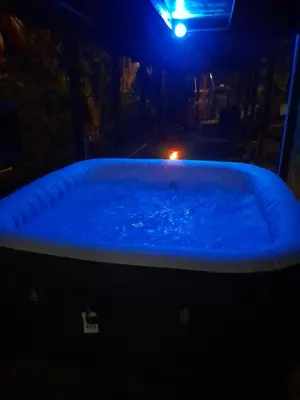 a hot tub in a dark room at night at CocoRelax in Siquirres