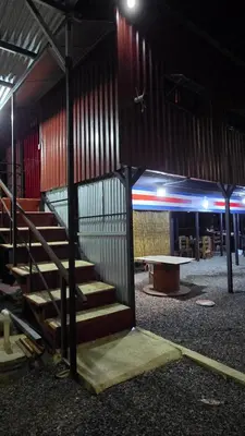 a group of stairs in a building at night at CocoRelax in Siquirres