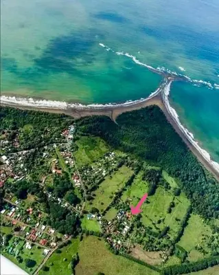 an aerial view of the beach and the ocean at Luciernaga in Bahia