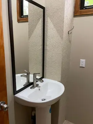 a bathroom with a sink and a mirror at Luciernaga in Bahia