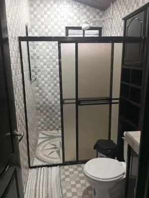 a bathroom with a shower with a toilet in it at Linda vista in Bijagua