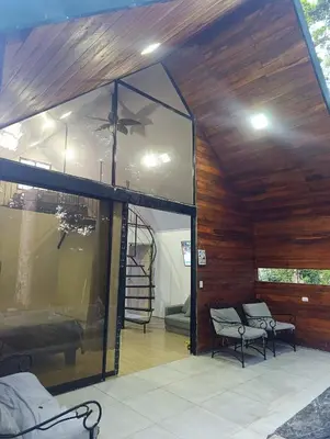 a room with a glass wall with a ceiling at Kono Rainbow Finca paraíso in Jiménez
