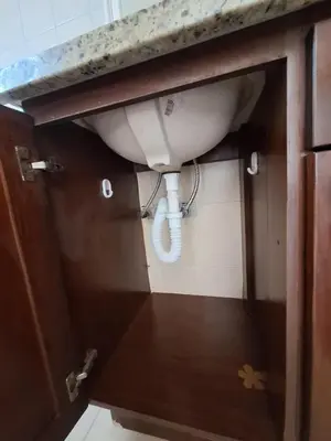 a sink in a bathroom under a cabinet at Villa Prados del Rio 47 in Comunidad