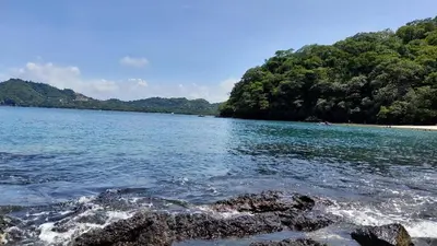 a large body of water with trees and rocks at Villa Prados del Rio 47 in Comunidad