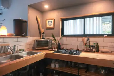 a kitchen with a sink and a stove top oven at Jungle house in Santa Teresa in Santa Teresa Beach