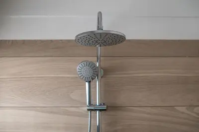 a shower head in a bathroom with a wooden floor at Japandi Tropical Stay in Puntarenas