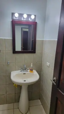 a bathroom with a sink and a mirror at Playas del Coco Cocomarindo 23 in Coco