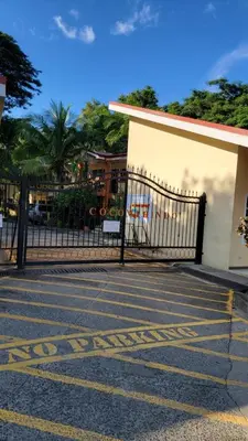 a black fence in front of a building at Playas del Coco Cocomarindo 23 in Coco