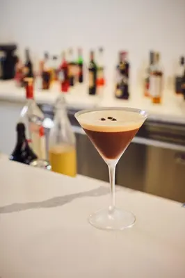 a drink in a martini glass sitting on a counter at Ocotea Boutique Hotel in Monteverde Costa Rica