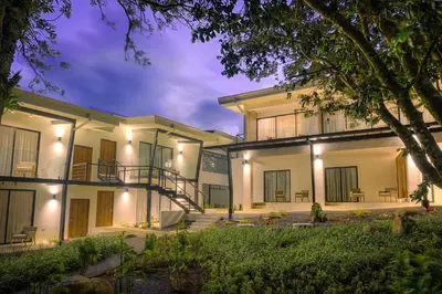 an exterior view of a building at night at Ocotea Boutique Hotel in Monteverde Costa Rica