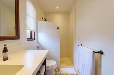 a bathroom with a toilet and a sink and a shower at Casa Brisa At Las Catalinas in Playa Danta