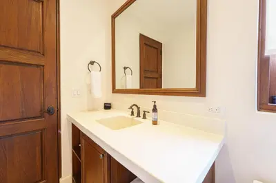 a bathroom with a white sink and a mirror at Casa Brisa At Las Catalinas in Playa Danta