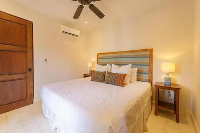 a bedroom with a bed and a ceiling fan at Casa Brisa At Las Catalinas in Playa Danta
