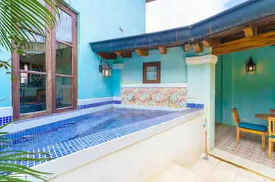a house with a swimming pool and a table at Casa Brisa At Las Catalinas in Playa Danta