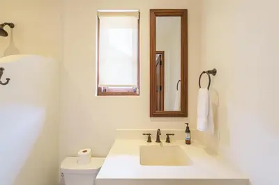 a white bathroom with a sink and a toilet at Casa Brisa At Las Catalinas in Playa Danta