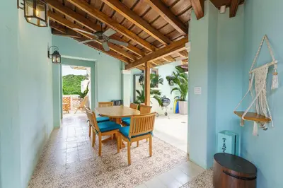 a dining room with a table and chairs at Casa Brisa At Las Catalinas in Playa Danta