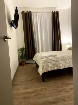 a bedroom with two beds and a window at Luxury Loft in San Jose CR in San José