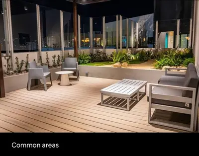 a room with chairs and a table and a bench at Luxury Loft in San Jose CR in San José