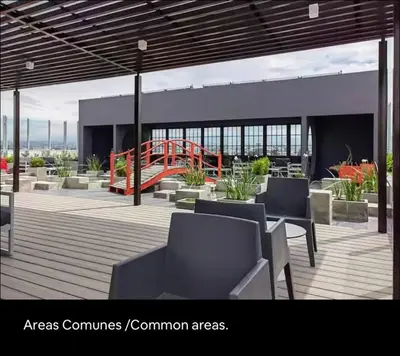 a patio with tables and chairs on a building at Luxury Loft in San Jose CR in San José