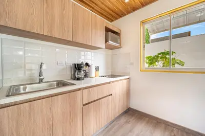 a kitchen with a sink and a window at Macondo Ecolodge in Coco