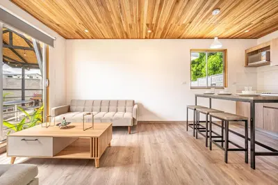 a living room with a couch and a table at Macondo Ecolodge in Coco