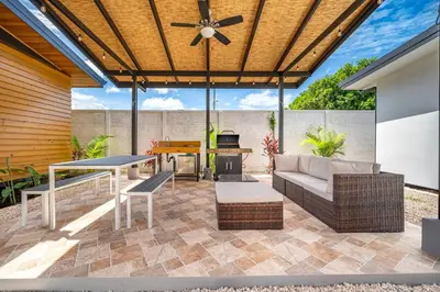 a patio with a couch and a table at Macondo Ecolodge in Coco