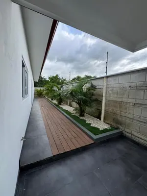 a hallway of a house with a wooden walkway at Casa fortuna 777 in Agua Azul