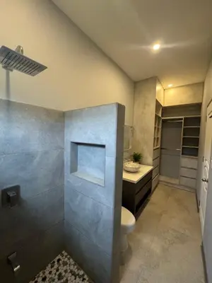 a bathroom with a toilet and a sink at Casa fortuna 777 in Agua Azul