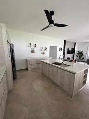 a kitchen with a ceiling fan and a sink at Casa fortuna 777 in Agua Azul