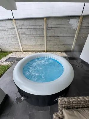 a large bath tub sitting on top of a patio at Casa fortuna 777 in Agua Azul