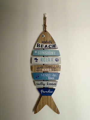 a christmas ornament of a wooden egg with beach sunshine at Entire home with Private Pool - Coralita in Jaco, gated community, walking distance to Jaco Beach in Jacó