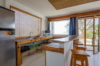 a kitchen with a sink and a counter top at Ocean View Bungalows in Pital